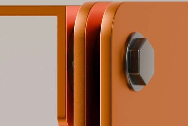 Close-up of precision-engineered modular panel connection with orange powder-coated finish and hexagonal bolt, showcasing durable joinery for fit-out and refurbishment projects.