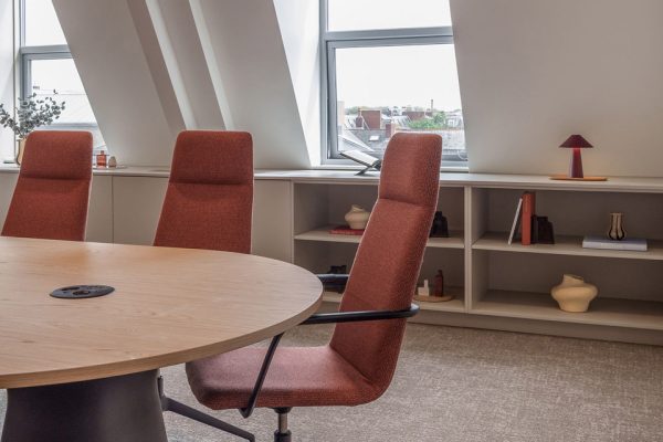 Workplace design detail showing CAT B meeting room with feature glazing, integrated storage and natural daylight.